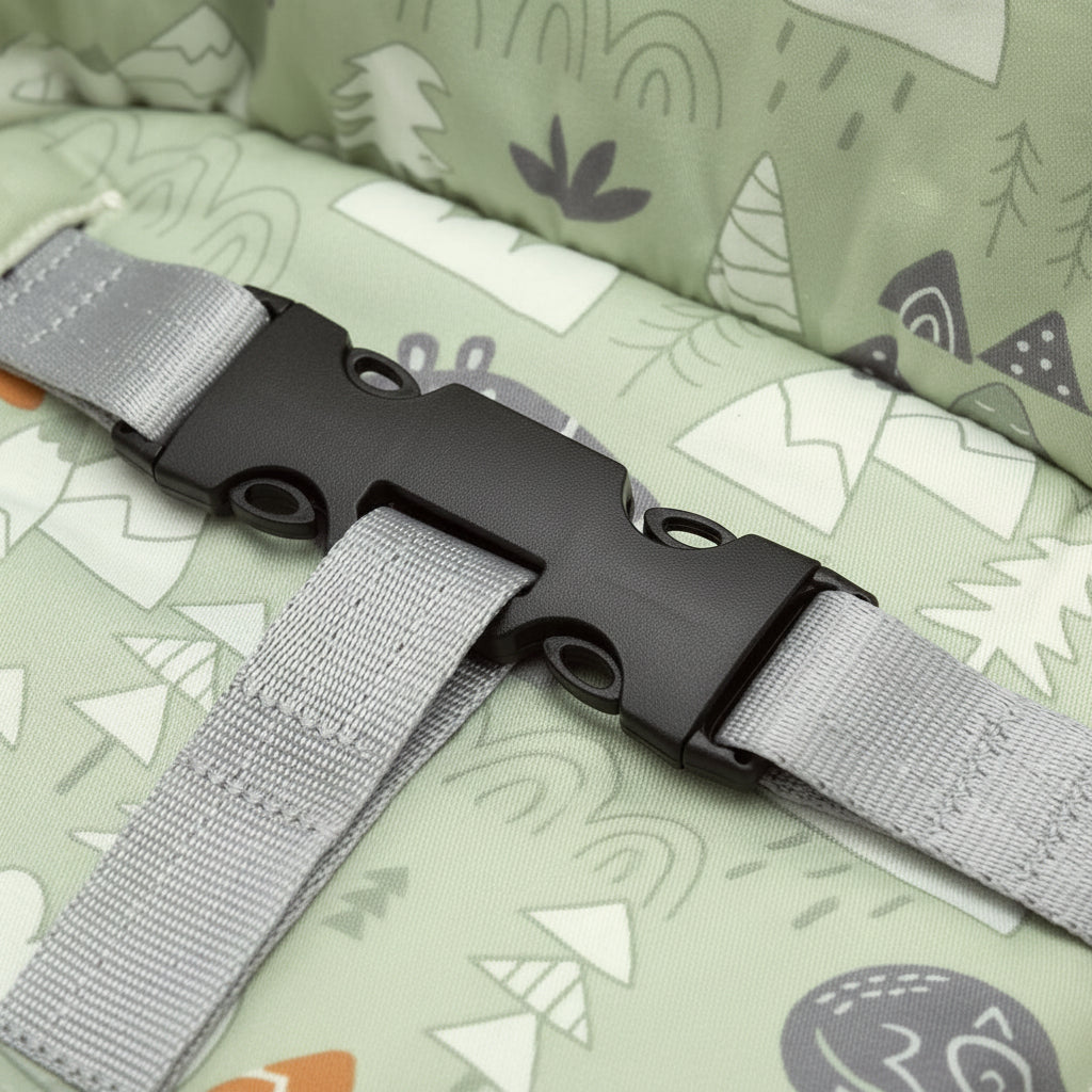 Gray strap with black buckle on a patterned fabric background