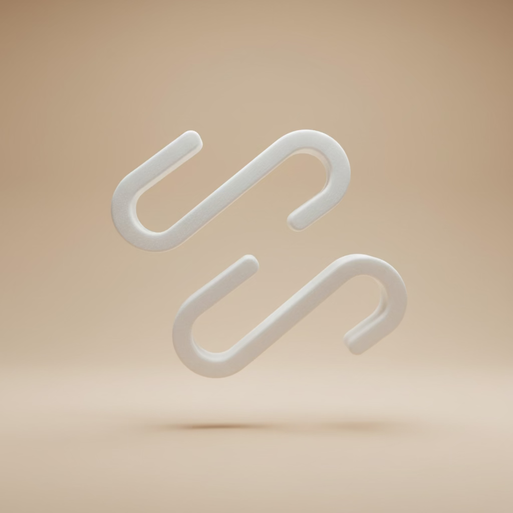 Two white plastic hooks on a beige background