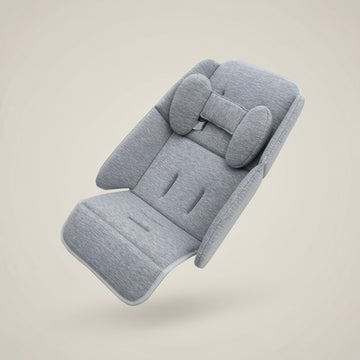 A light gray heathered fabric car seat cushion with integrated headrest and side bolsters, shown on a plain beige background.
