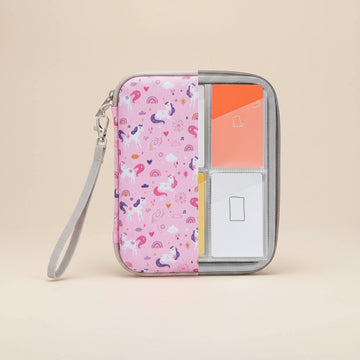 Pink case with unicorn pattern containing Yoto cards