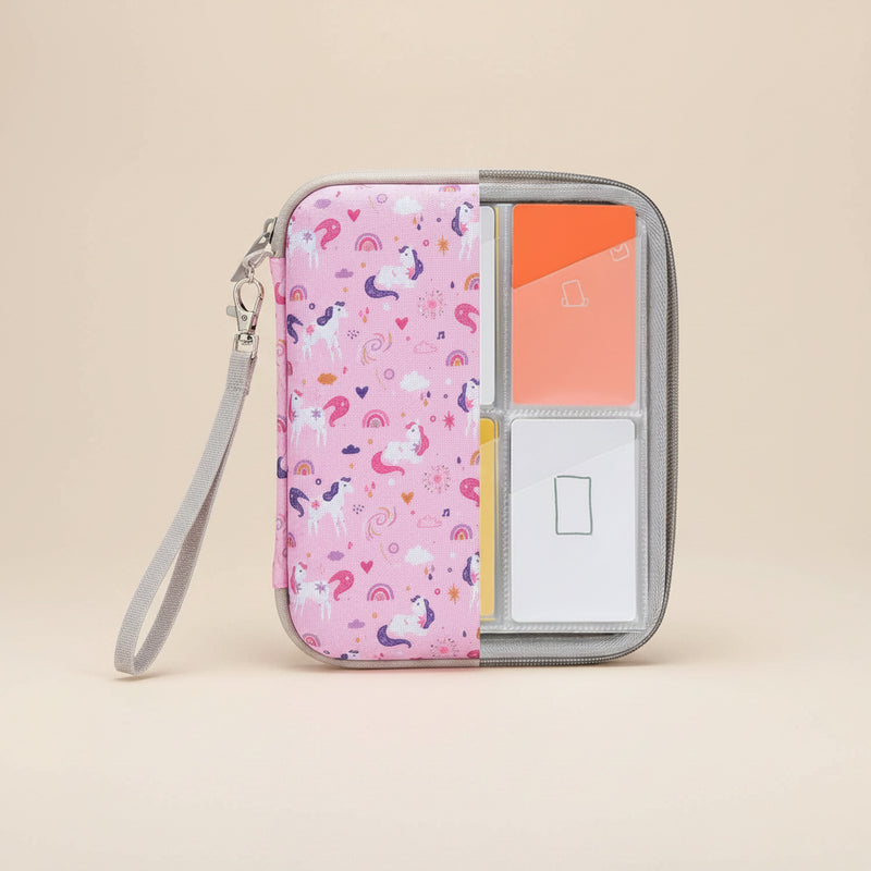 Pink case with unicorn pattern containing Yoto cards