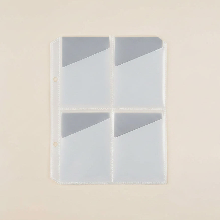 clear plastic sheet with multiple compartments on a beige background