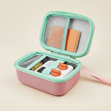 Portable case with earbuds and accessories on a white background