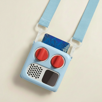 Blue toy radio with red buttons and a strap on a beige background