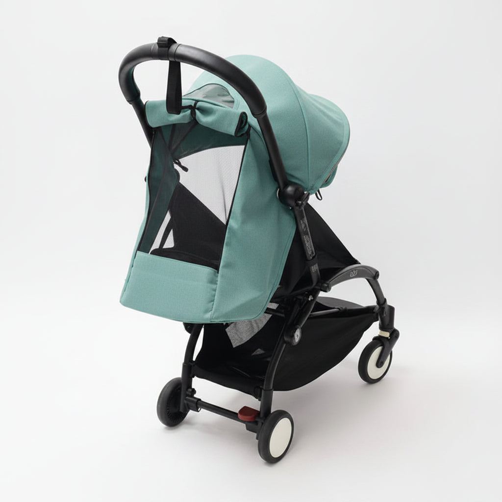A stroller with a aqua sun canopy and matching side cover, paired with a black frame and black mesh window panels, shown on a light gray studio background.