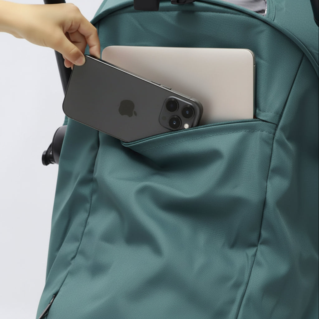A aqua backpack with a side pocket holding a dark gray smartphone and a silver laptop, with a hand reaching in to show the pocket's capacity.