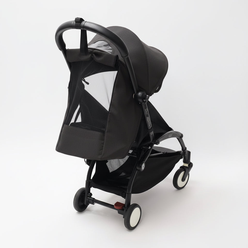 Black baby stroller with black frame on a white background