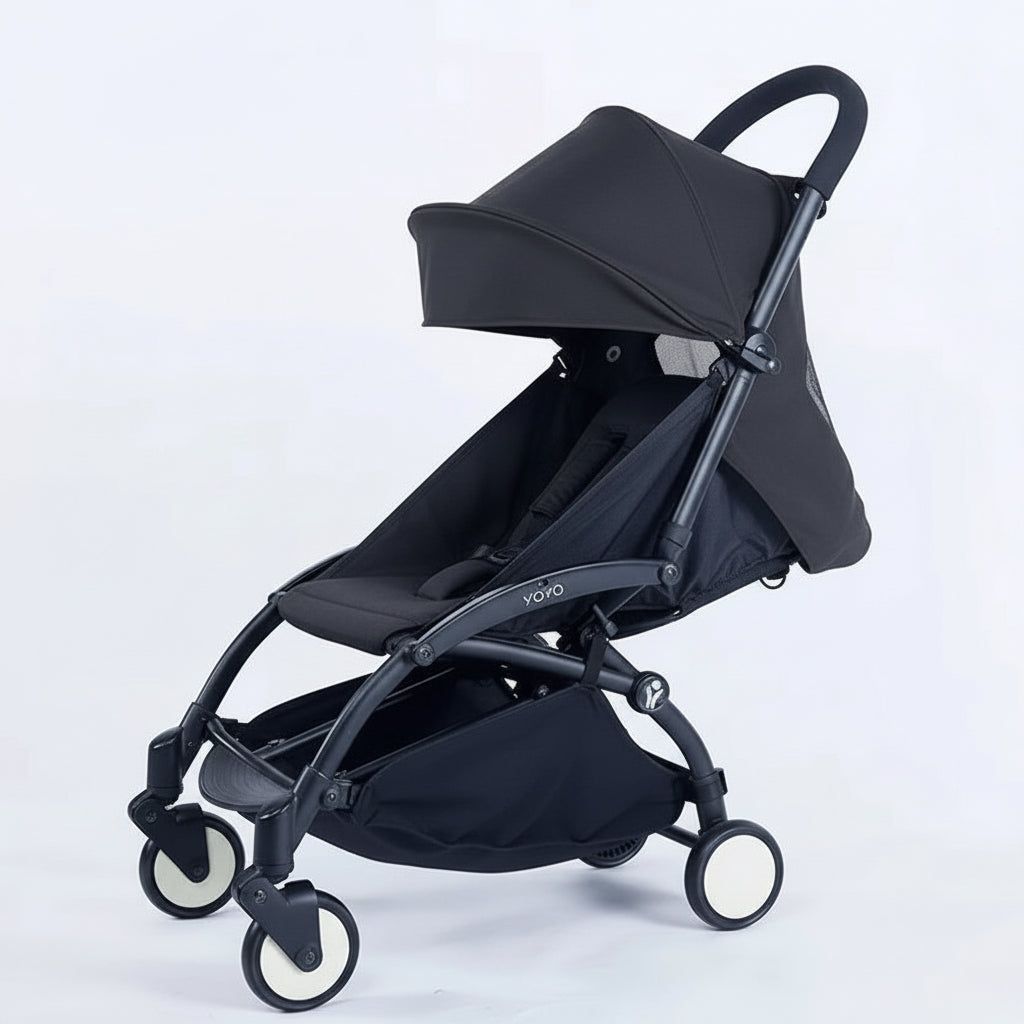 Baby stroller with black canopy and seat on a white background