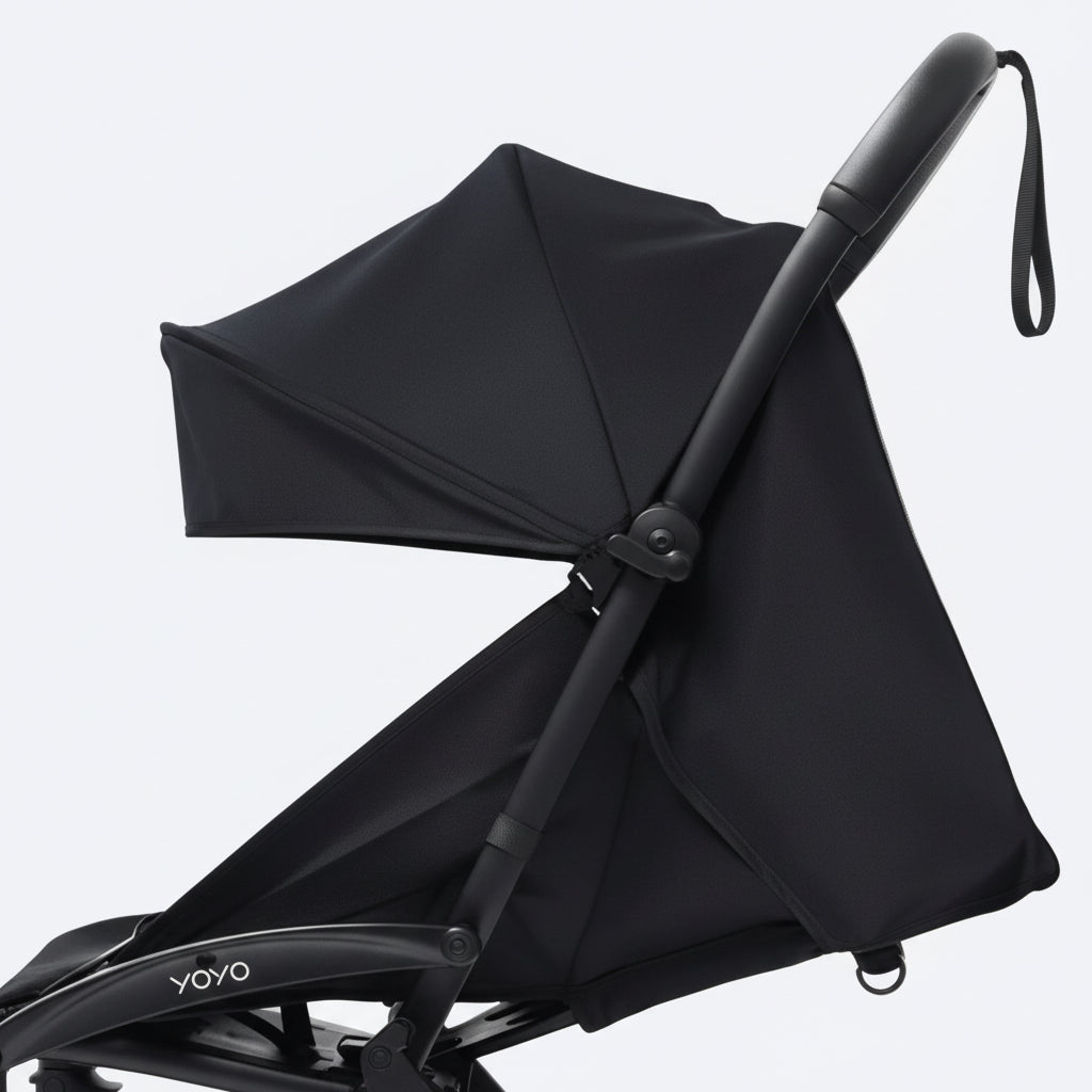 Black stroller with canopy on a white background
