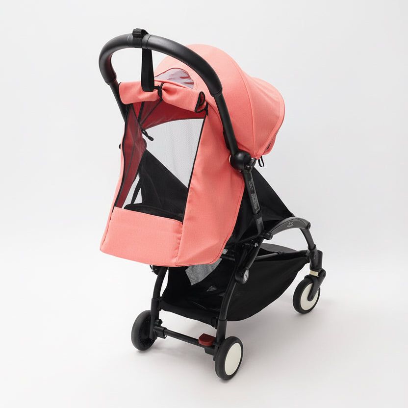 Light pink baby stroller on a white background