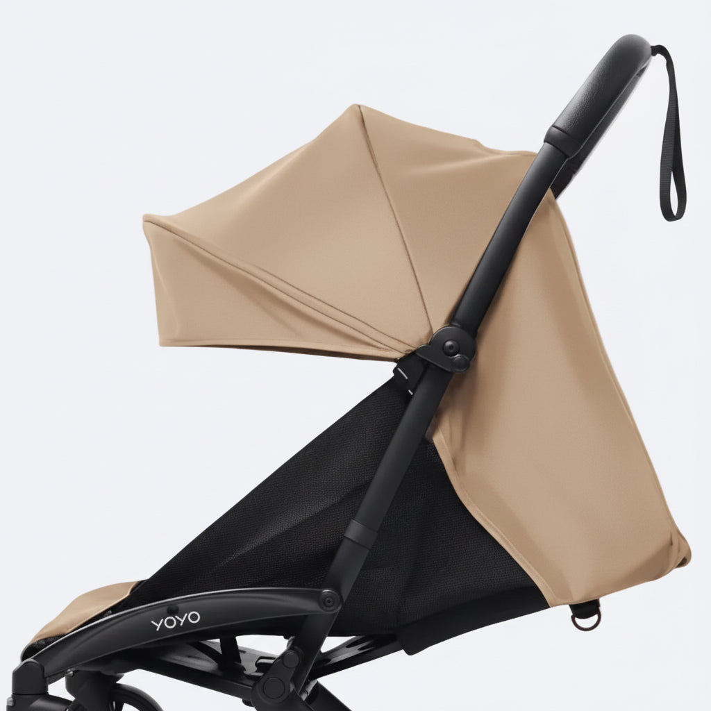 Baby stroller with a toffee canopy on a white background