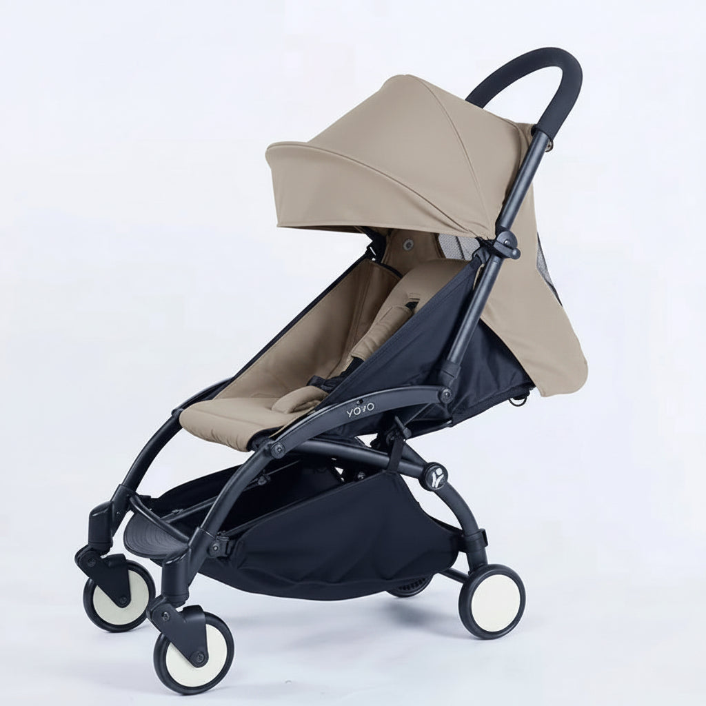 Baby stroller with toffee-colored canopy and seat on a white background