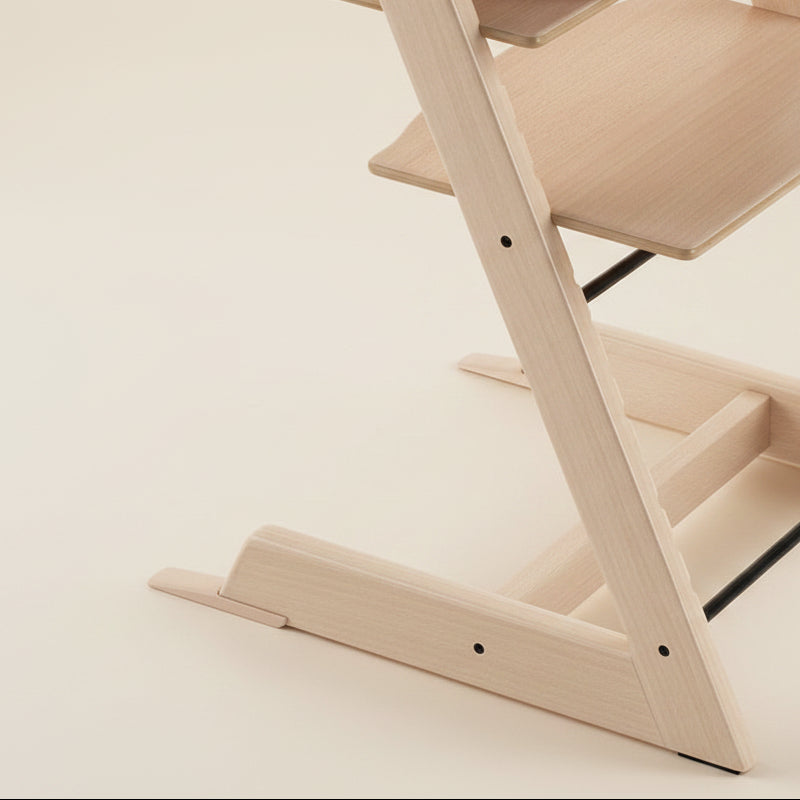Wooden high chair on a white background